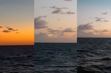 UFO？美国北卡罗莱纳州外海黄昏海面天空出现14个奇异光点